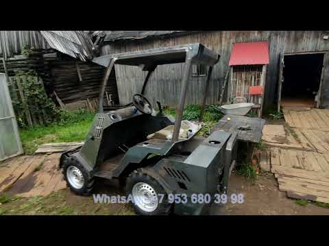 Видео: Самодельный минипогрузчик на гидроходу. Обшивка передней полурамы, установка кабины.