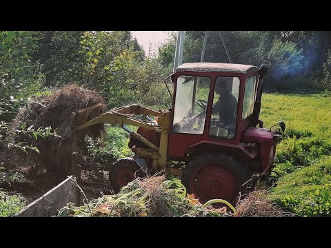 Видео: обзор трактора Т-16 с самодельным куном и передним приводом от уаз