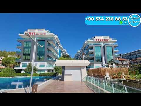 Видео: ВИДОВАЯ ПРОСТОРНАЯ 1+1 квартира в Алании НА МОРЕ недвижимость в Турции ПОД КЛЮЧ