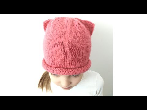 Видео: Вязание спицами. Шапка с ушками