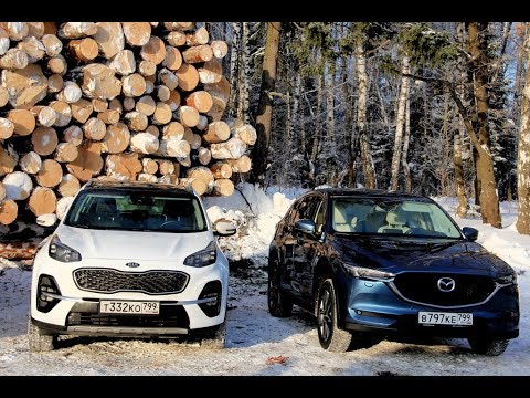 Видео: Киа Спортейдж - Мазда СХ 5: тест обзор на лесоповале