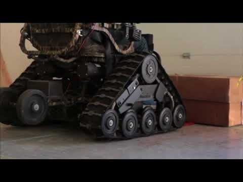 Видео: коляска вездеход вертикализатор с электроприводом на все случаи жизни