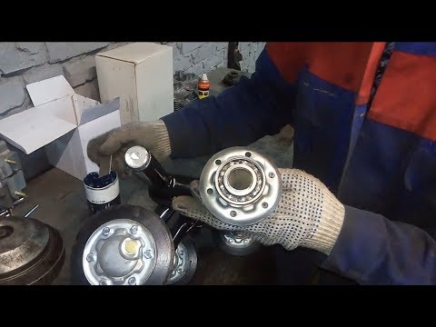 Видео: Обслуживание подшипников в тележках на примере мотобуксировщика БУРЛАК М