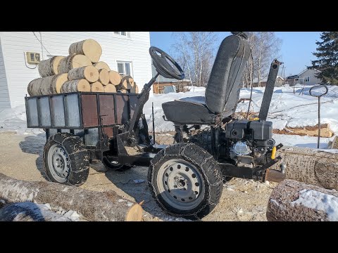 Видео: Минитрактор 4×4 в работе, тянет брёвна.