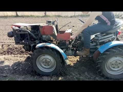 Видео: TZ4K14 Модернизирован 1.9 D работа плугом