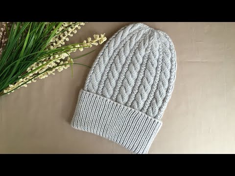 Видео: ВЯЗАНАЯ ЖЕНСКАЯ ШАПКА "ЖЕМЧУЖНЫЕ КОСЫ" KNITTED HAT