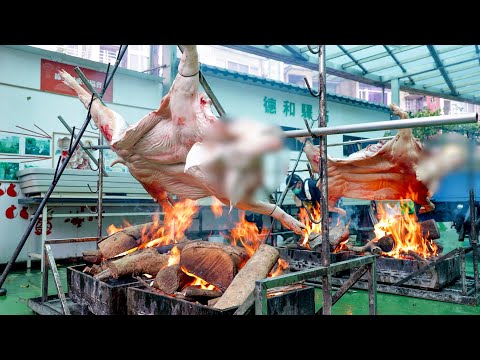Видео: Готовка цельной жареной свиньи в городе и в горах