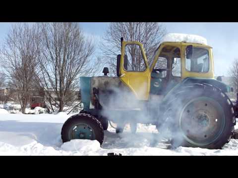 Видео: пуск трактора ЮМЗ 6 в минус 25 с лампой