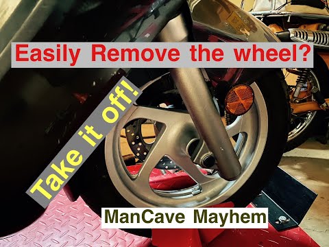 Видео: Как снять переднее колесо на Yamaha Majesty 400