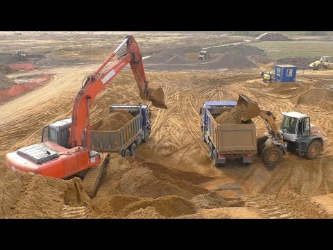 Видео: Погрузка самосвалов Scania экскаватором Hitachi Zaxis 200 и погрузчиком Liebherr L534
