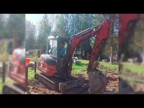 Видео: Сертолово. Выкапываем огромный камень мини-экскаватором.