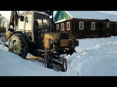 Видео: Расчистка снега на ЮМЗ 6