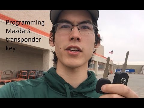 Видео: Программирование транспондерного ключа для Mazda 3 2012 года