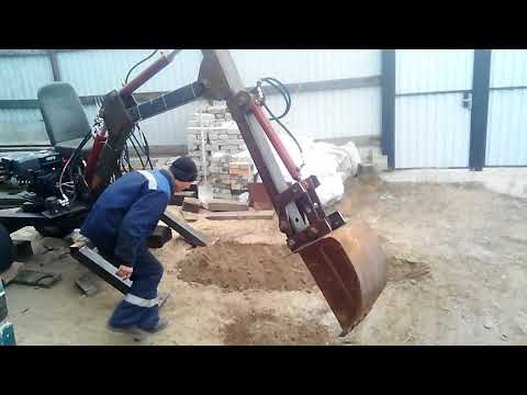 Видео: Мини экскаватор. Замена ремней на цепь.