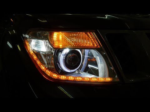 Видео: Nissan Pathfinder тюнинг и ремонт фар установка ДХО, ангельских глазок и светодиодных модулей Optima