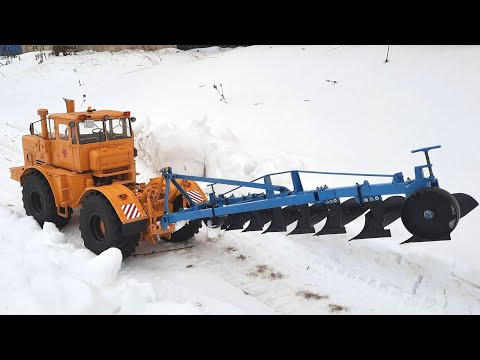 Видео: Трактор К 701 Как вспахать снег и зачем...