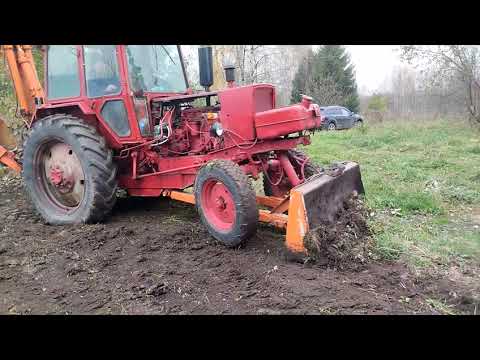 Видео: Экскаватор ЮМЗ - планировка участка