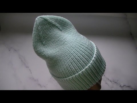 Видео: МОДНАЯ, ДВУХСТОРОННЯЯ ШАПКА ЛУКОВКА СПИЦАМИ.