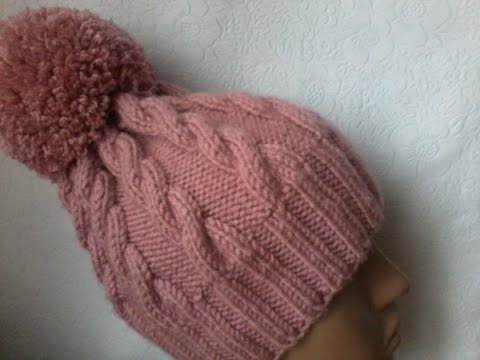 Видео: Вязание шапки с косами спицами.