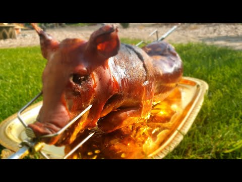 Видео: Жареный поросёнок на вертеле