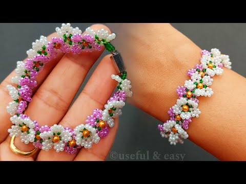Видео: Цветущая красота🌸Руководство по созданию браслета-цветка из бисера / Полезно и просто
