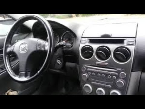 Видео: Мазда 6 как снять центральную панель