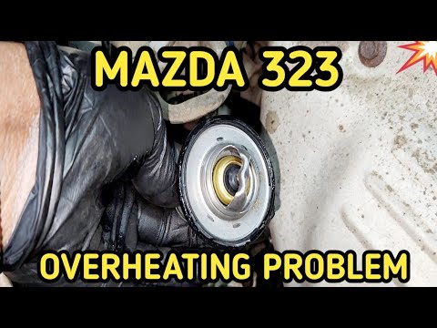 Видео: Замена термостата Mazda 323 BJ Protege