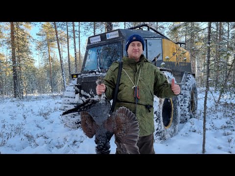 Видео: Тайга и охота зимой на вездеходе Тайфун. Typhoon all-terrain vehicle hunting in the Russian forest.