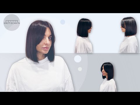 Видео: КАК СТРИЧЬ КЛАССИЧЕСКОЕ КАРЕ с длинной челкой, техника стрижки - НИКИТОЧКИН