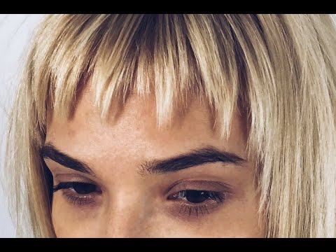 Видео: Женская стрижка слоями с применением дисконекции, короткая челка