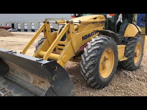 Видео: Универсальный солдат))) Экскаватор погрузчик Komatsu WB97s