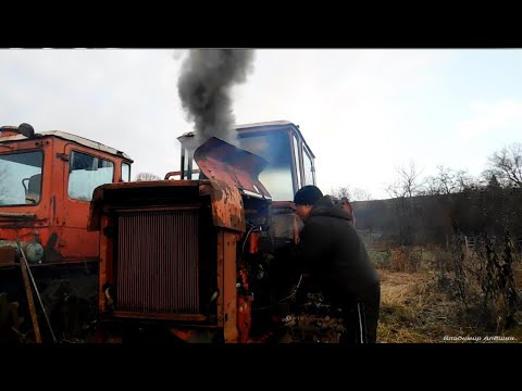 Видео: Запуск ДТ-75 после простоя! Примёрзли гусеницы! Starting the tractor after downtime