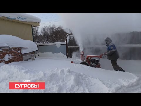 Видео: Уборка снега мотоблоком МТЗ. Сугробы-полная версия.