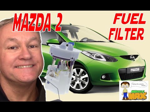 Видео: Замена топливного фильтра Mazda 2