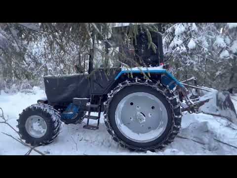 Видео: мтз 82 с лебёдкой в лесу