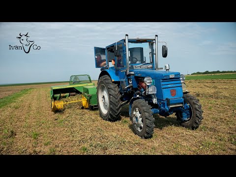 Видео: Тюкування люцерни прес-підбирачем John Deere 330, та трактором Т-40.