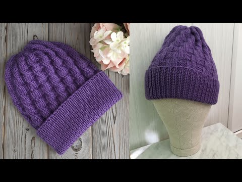 Видео: ШАПКА СПИЦАМИ С ОЧЕНЬ ИНТЕРЕСНЫМ УЗОРОМ, КОТОРЫЙ ИМИТИРУЕТ КОСЫ ! KNITTEDHAT