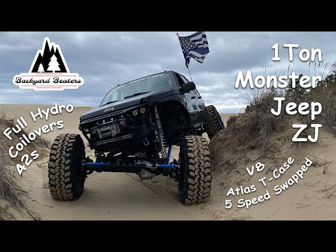 Видео: МОНСТР Jeep Grand Cherokee ZJ на тоннах и койловерах | Обзор Wheeler