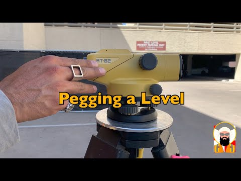 Видео: Геодезия: установка уровня