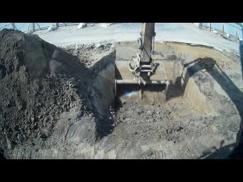 Видео: Работа экскаватора планировочным ковшом