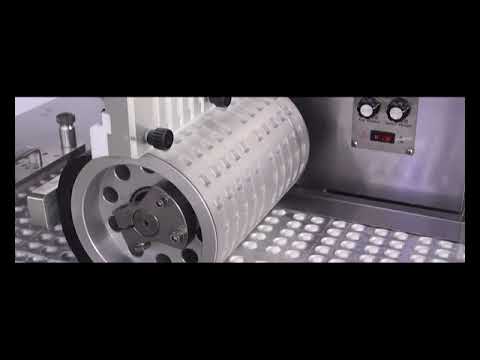 Видео: Упаковка таблеток в блистеры - блистерная машина