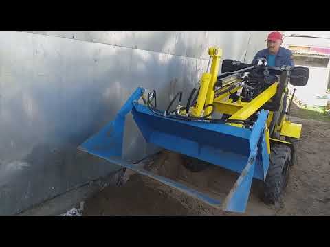 Видео: мини погрузчик с  челюстным ковшом