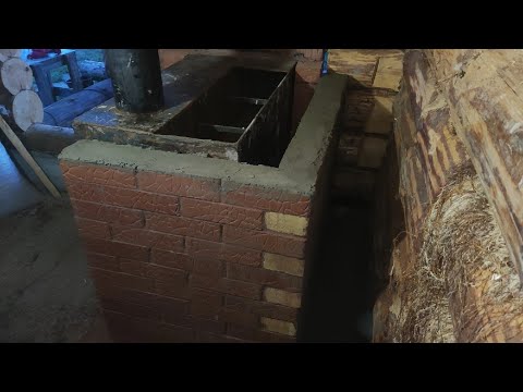 Видео: Обкладка печи и нижнего венца, первая растопка