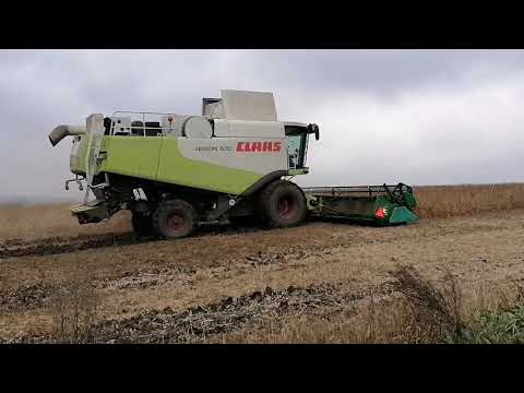 Видео: John Deere T-670(4WD),CLAAS Lexion 570,Axion 940.Дощі.Соя.Боротьба за урожай # johndeere #claas