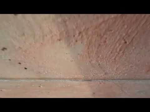 Видео: Штукатурка по горизонтальным маякам