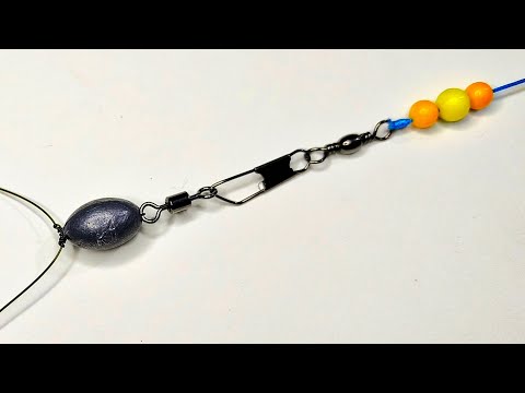 Видео: Как связать два крючка с грузилом для рыбалки.