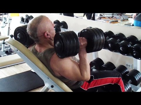 Видео: Жим гантелей на регулируемой скамье. Упражнение для плеч