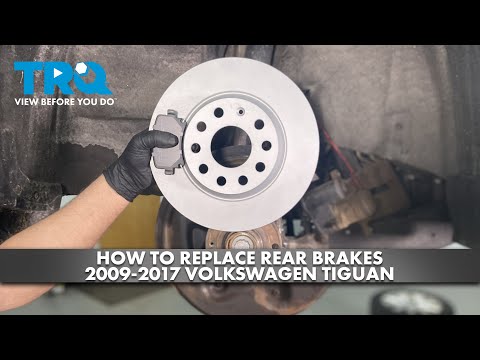Видео: Как заменить задние тормоза на Volkswagen Tiguan 2009-2017