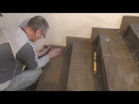 Видео: Облицовка керамогранитом лестницы в частном доме .