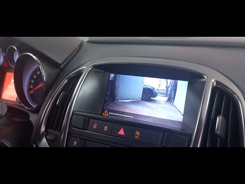 Видео: Установка камеры заднего вида на Opel Astra J